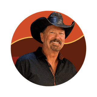 Bruce Woodburn smiling in a cowboy hat, featured as an Orlando mortgage lender.